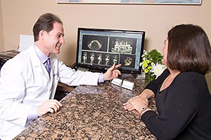 Dentist with patient explaining procedure